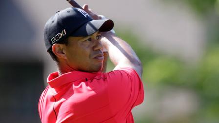 Tiger Woods tees off on the 18th hole during the final round of the Memorial golf tournament on Sunday, June 3, 2012, in Dublin, Ohio. Woods birdied the hole. (AP Photo/Tony Dejak)