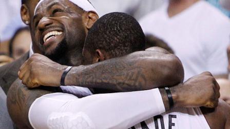 Miami Heat small forward LeBron James (6) and shooting guard Dwyane Wade react in the final moments during the second half at Game 5 of the NBA finals basketball series, Thursday, June 21, 2012, in Miami. The Heat won 121-106 to become the 2012 NBA Champions.(AP Photo/Lynne Sladky)