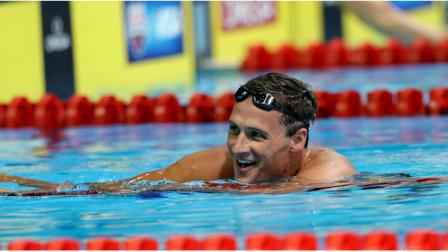 Ryan Lochte smiles after swimming in the mens 400-meter individual medley final at the U.S. Olympic swimming trials, Monday, June 25, 2012, in Omaha, Neb. (AP Photo/David Phillip)