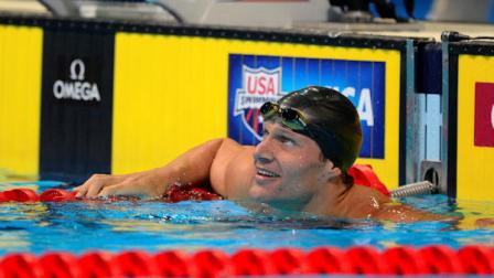 Brendan Hansen smiles as he looks at the time after swimming in the mens 100-meter breaststroke preliminaries at the U.S. Olympic swimming trials, Monday, June 25, 2012, in Omaha, Neb. (AP Photo/Mark J. Terrill)