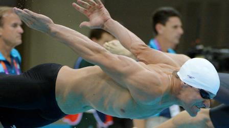 United States Brendan Hansen dives to swim in a mens 100-meter breaststroke heat at the Aquatics Centre in the Olympic Park during the 2012 Summer Olympics in London, Saturday, July 28, 2012. (AP Photo/Mark J. Terrill)