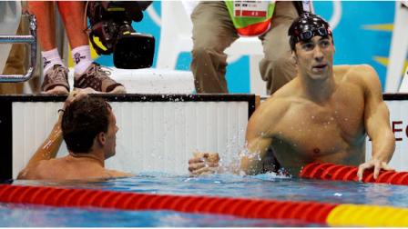 United States Michael Phelps, right, shakes hands with silver medalist Ryan Lochte of the United States after winning gold in the mens 200-meter individual medley swimming final at the Aquatics Centre in the Olympic Park during the 2012 Summer Olympics in London, Thursday, Aug. 2, 2012. (AP Photo/Michael Sohn)