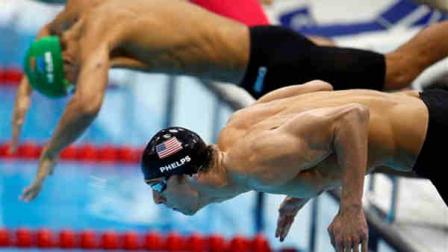 South Africas Chad le Clos, top, and United States Michael Phelps take the start in the mens 100-meter butterfly swimming final at the Aquatics Centre in the Olympic Park during the 2012 Summer Olympics, London, Friday, Aug. 3, 2012. (AP Photo/Jae C. Hong)