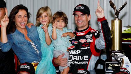 Jeff Gordon celebrates in victory lane with his wife Ingrid Vandebosch, daughter Ella Sofia and son Leo Benjamin after winning the NASCAR Sprint Cup Series auto race, Sunday, Aug. 5, 2012, at Pocono Raceway in Long Pond, Pa. (AP Photo/LAT, Lesley Ann Miller) MANDATORY CREDIT