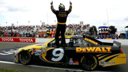 Marcos Ambrose stands on his car as he celebrates his win at the NASCAR Sprint Cup Series auto race at Watkins Glen International, Sunday, Aug. 12, 2012, in Watkins Glen, N.Y. (AP Photo/Autostock, Russell LaBounty)