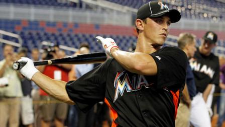 Newly signed Miami Marlins Adam Greenberg swings his bat before a baseball game against the New York Mets in Miami, Tuesday, Oct. 2, 2012. (AP Photo/Alan Diaz)