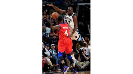 Philadelphia 76ers forward Dorell Wright (4) is fouled by Memphis Grizzlies guard Quincy Pondexter (20) in the first half of an NBA basketball game on Wednesday, Dec. 26, 2012, in Memphis, Tenn. (AP Photo/Nikki Boertman)