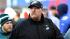 Philadelphia Eagles head coach Andy Reid walks...