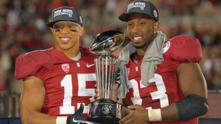 Offensive and Defensive MVP players Stanford running back Stepfan Taylor, right, joins Stanford cornerback Usua Amanam hold the trophy after defeating Wisconsin during the second half at the Rose Bowl NCAA college football game Tuesday, Jan. 1, 2013, in Pasadena, Calif. (AP Photo/Mark J. Terrill)