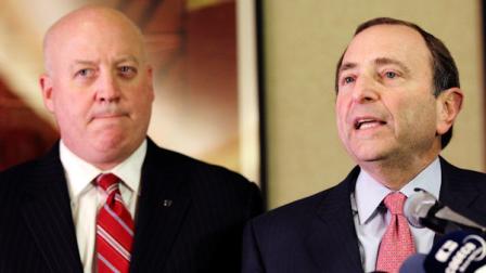 FILE - In this Dec. 6, 2012, file photo, NHL Commissioner Gary Bettman, right, and deputy commissioner Bill Daly speak to reporters in New York. (AP Photo/Mary Altaffer, File)