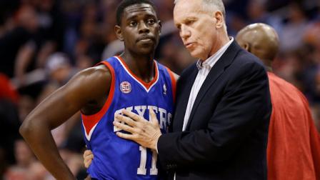 Philadelphia 76ers head coach Doug Collins, right, talks with Jrue Holiday (11) during a break in the action against the Phoenix Suns during the first half of an NBA basketball game on Wednesday, Jan. 2, 2013, in Phoenix. (AP Photo/Ross D. Franklin)