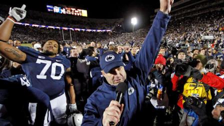 FILE - In this Nov. 24, 2012, file photo, Penn State head coach Bill OBrien, center, celebrates with his team after their 24-21 overtime win over Wisconsin in an NCAA college football game in State College, Pa. (AP Photo/Gene J. Puskar, File)