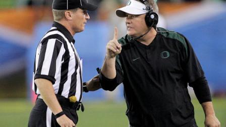 Oregon head coach Chip Kelly, right, signals a 1-point safety to the referee during the second half of the Fiesta Bowl NCAA college football game against Kansas State, Thursday, Jan. 3, 2013, in Glendale, Ariz. (AP Photo/Matt York)