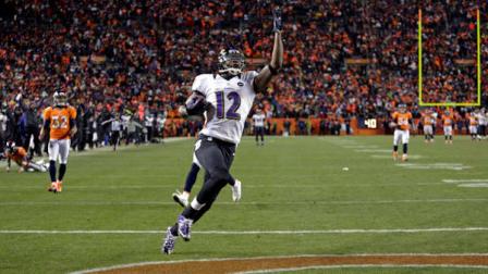 Baltimore Ravens wide receiver Jacoby Jones celebrates as he crosses the goal line for a touchdown against the Denver Broncos in the fourth quarter of an AFC divisional playoff NFL football game, Saturday, Jan. 12, 2013, in Denver. (AP Photo/Joe Mahoney)