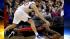 Toronto Raptors Amir Johnson, bottom, dives for...
