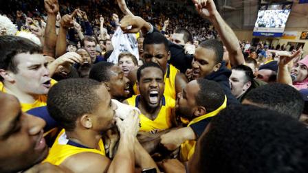 La Salles Ramon Galloway, center, is mobbed by teammates and fans after La Salle won an NCAA college basketball game against Butler, Wednesday, Jan. 23, 2013, in Philadelphia. La Salle won 54-53. (AP Photo/Matt Slocum)