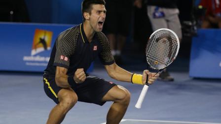 Serbias Novak Djokovic celebrates his win over Britains Andy Murray in the mens final at the Australian Open tennis championship in Melbourne, Australia, Sunday, Jan. 27, 2013. (AP Photo/Aaron Favila)