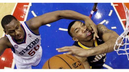 Indiana Pacers Orlando Johnson, right, is fouled by Philadelphia 76ers Lavoy Allen while taking a shot during the second half of an NBA basketball game, Wednesday, Feb. 6, 2013, in Philadelphia. Indiana won 88-69. (AP Photo/Matt Slocum)