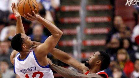 Philadelphia 76ers Evan Turner (12) shoot over Los Angeles Clippers DeAndre Jordan (6) in the first half of an NBA basketball game, Monday, Feb. 11, 2013, in Philadelphia. (AP Photo/H. Rumph Jr)