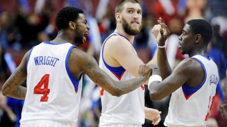Philadelphia 76ers Dorell Wright, from left, Spencer Hawes and Jrue Holiday celebrate after a basket by Holiday during the second half of an NBA basketball game against the Portland Trail Blazers, Monday, March 18, 2013, in Philadelphia. Philadelphia won 101-100. (AP Photo/Matt Slocum)