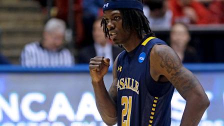 La Salle guard Tyrone Garland (21) pumps his fist after a teammate made a free throw in the closing seconds of a first-round game against Boise State in the NCAA college basketball tournament, Wednesday, March 20, 2013, in Dayton, Ohio. Garland led La Salle to an 80-71 win with 22 points. (AP Photo/Al Behrman)