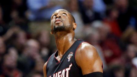 Miami Heat guard Dwyane Wade looks up at a scoreboard after he was called for a foul on Chicago Bulls guard Jimmy Butler during the first half of an NBA basketball game in Chicago on Wednesday, March 27, 2013. (AP Photo/Nam Y. Huh)