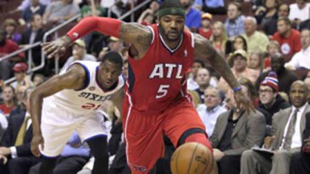 Philadelphia 76ers Thaddeus Young (21) and Atlanta Hawks Josh Smith (5) in NBA basketball action Wednesday, April 10, 2013, in Philadelphia. The Hawks won 124-101. (AP Photo/H. Rumph Jr)