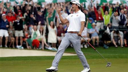 Adam Scott, of Australia, celebrates after a birdie putt on the 18th green during the fourth round of the Masters golf tournament Sunday, April 14, 2013, in Augusta, Ga. (AP Photo/David J. Phillip)