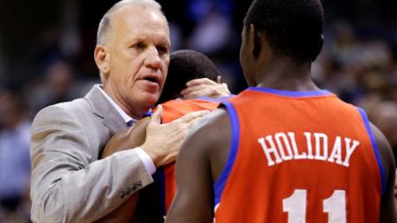 Philadelphia 76ers head coach Doug Collins, left, hugs forward Thaddeus Young as guard Jrue Holiday looks on before their NBA basketball game against the Indiana Pacers in Indianapolis, Wednesday, April 17, 2013. (AP Photo/Michael Conroy)