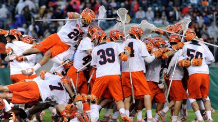 The Syracuse lacrosse team celebrates their 9-8 win over Denver at the end of an NCAA college Division 1 semifinal lacrosse game on Saturday, May 25, 2013, in Philadelphia. (AP Photo/Michael Perez)