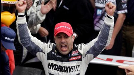 Tony Kanaan, of Brazil, celebrates after winning the Indianapolis 500 auto race at the Indianapolis Motor Speedway in Indianapolis, Sunday, May 26, 2013. (AP Photo/Michael Conroy)