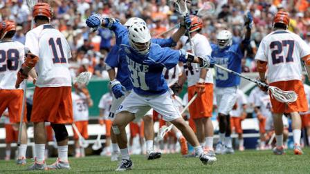 Dukes Jordan Wolf (31) celebrates after scoring a goal during the first half of an NCAA college Division I championship final lacrosse game against Syracuse on Monday, May 27, 2013, in Philadelphia. (AP Photo/Michael Perez)