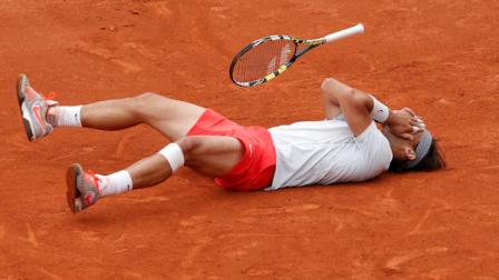 Spains Rafael Nadal celebrates winning against compatriot David Ferrer in three sets 6-3, 6-2, 6-3, in the final of the French Open tennis tournament, at Roland Garros stadium in Paris, Sunday June 9, 2013. (AP Photo/Christophe Ena)