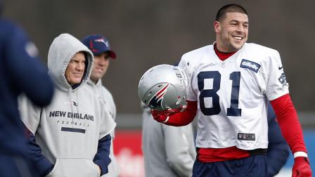 New England Patriots tight end Aaron Hernandez (81) stands on the field with head coach Bill Belichick, left, during NFL football practice at Gillette Stadium in Foxborough, Mass., Wednesday, Dec. 19, 2012.