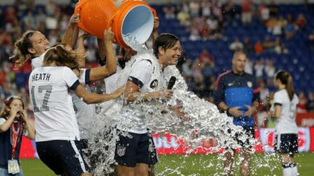 United States Abby Wambach, right, is showered by teammates after an international friendly soccer match against South Korea at Red Bull Arena, Thursday, June 20, 2013, in Harrison, N.J. The U.S. won 5-0. Wambach is now the greatest goal scorer in international soccer. She scored four goals in the first half to break Mia Hamms record.