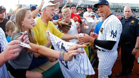 New York Yankees third baseman Alex Rodriguez (13) signs autographs before a Class AA baseball game with the Trenton Thunder against the Reading Phillies Saturday, Aug. 3, 2013, in Trenton, N.J. (AP Photo/Rich Schultz)