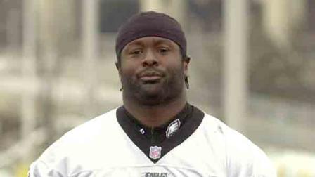 Former Philadelphia Eagle Hugh Douglas arrives at practice Wednesday, Jan. 23, 2002, in Philadelphia.