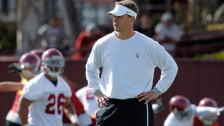 Southern California head football coach Lane Kiffin watches during football practice in Los Angeles, Tuesday, March 30, 2010.