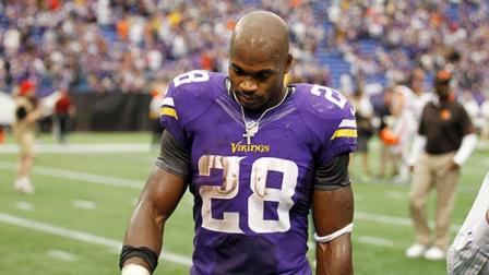 Minnesota Vikings running back Adrian Peterson walks off the field after a 31-27 loss to the Cleveland Browns in an NFL football game Sunday, Sept. 22, 2013, in Minneapolis.
