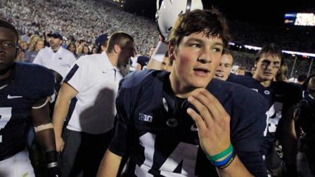Penn State quarterback Christian Hackenberg (14) celebrates with teammates Penn State beat Michigan 43-40 during an NCAA college football game in State College, Pa., Saturday, Oct. 12, 2013. (AP Photo/Gene J. Puskar)