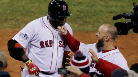 Boston Red Soxs David Ross tugs on the beard of David Ortiz, left, after Ortiz hit a two-run home run in the seventh inning of Game 1 of baseballs World Series against the St. Louis Cardinals Wednesday, Oct. 23, 2013, in Boston. (AP Photo/Charles Krupa)
