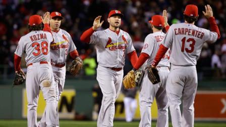 St. Louis Cardinals players celebrate after defeating the Boston Red Sox, 4-2, in Game 2 of baseballs World Series Thursday, Oct. 24, 2013, in Boston. The series is tied at 1-1. (AP Photo/Matt Slocum)