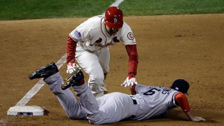 St. Louis Cardinals Allen Craig gets tangled with Boston Red Soxs Will Middlebrooks during the ninth inning of Game 3 of baseballs World Series Saturday, Oct. 26, 2013, in St. Louis. Middlebrooks was called for obstruction on the play and Craig went in to score the game-winning run. The Cardinals won 5-4 to take a 2-1 lead in the series.