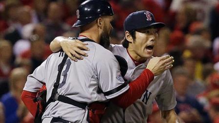 Boston Red Sox relief pitcher Koji Uehara hugs catcher David Ross after getting St. Louis Cardinals Matt Holliday to fly out and end Game 5 of baseballs World Series Monday, Oct. 28, 2013, in St. Louis. The Red Sox won 3-1 to take a 3-2 lead in the series.