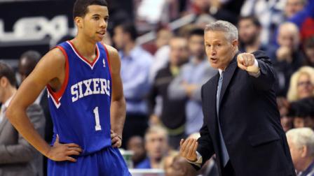 Philadelphia 76ers coach Brett Brown speaks to Michael Carter-Williams (1) as they play the Chicago Bulls in the second half of an NBA basketball game Saturday Nov. 2, 2013, in Philadelphia. The 76ers won 107-104. (AP Photo/H. Rumph Jr)