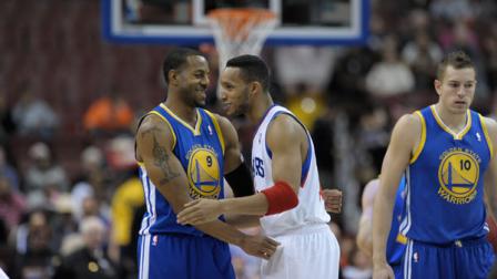 Golden State Warriors Andre Iguodala, left, and Philadelphia 76ers Evan Turner are seen during the first half of an NBA basketball game on Monday, Nov. 4, 2013, in Philadelphia. (AP Photo/Michael Perez)