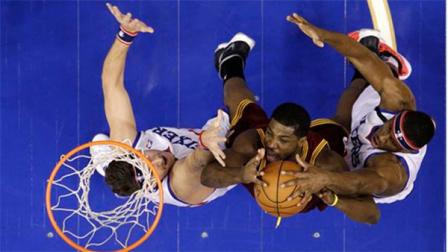 Cleveland Cavaliers Tristan Thompson, center, tries to get a shot past Philadelphia 76ers Spencer Hawes, left, and Thaddeus Young during the first half of an NBA basketball game, Friday, Nov. 8, 2013, in Philadelphia. (AP Photo/Matt Slocum)