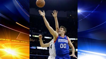 Philadelphia 76ers center Spencer Hawes (00) goes to the basket against New Orleans Pelicans center Jason Smith (14) in the first half of an NBA basketball game in New Orleans, Saturday, Nov. 16, 2013. (AP Photo/Gerald Herbert)
