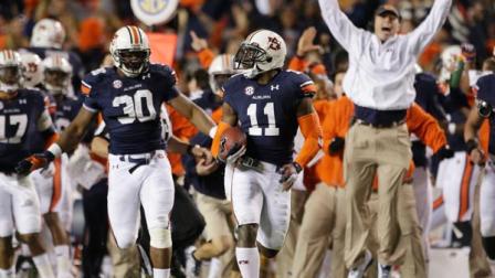 Auburn cornerback Chris Davis (11) returns a missed field-goal attempt 100-plus yards to score the game-winning touchdown as time expired in the fourth quarter of an NCAA college football game against No. 1 Alabama in Auburn, Ala., Saturday, Nov. 30, 2013. Auburn won 34-28. (AP Photo/Dave Martin)
