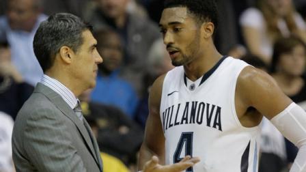 Villanova coach Jay Wright, left, talks to Darrun Hilliard in the second half of an NCAA college basketball game with Penn, Wednesday, Dec. 4, 2013, in Villanova. Villanova won 77-54. (AP Photo/Laurence Kesterson)